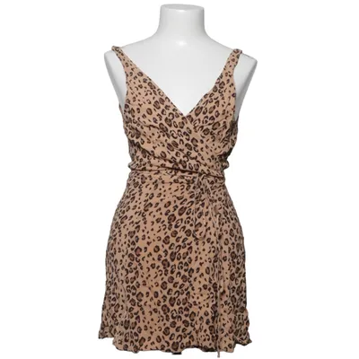 Omlottopp (Beige, Svart) från Reformation Viskos