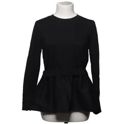 Top péplum (Noir) de COS Coton, Soie, Laine