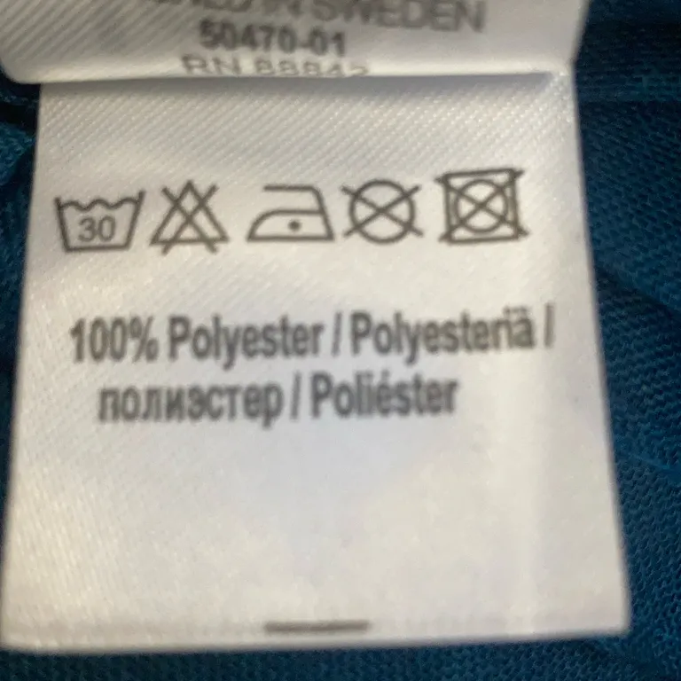 Panelgardin (Blå) från Jotex Polyester - Materialetikett
