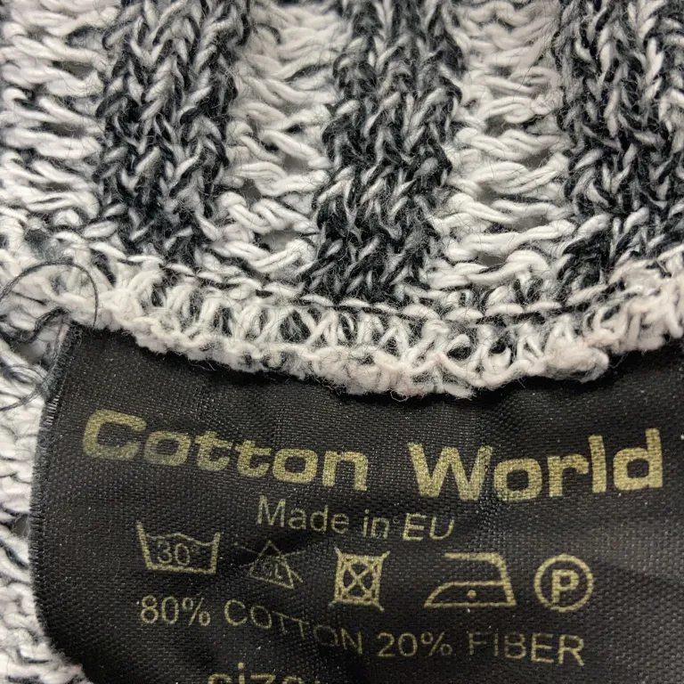 Bolero (Svart, Vit) från Cotton World Corp Bomull - Materialetikett