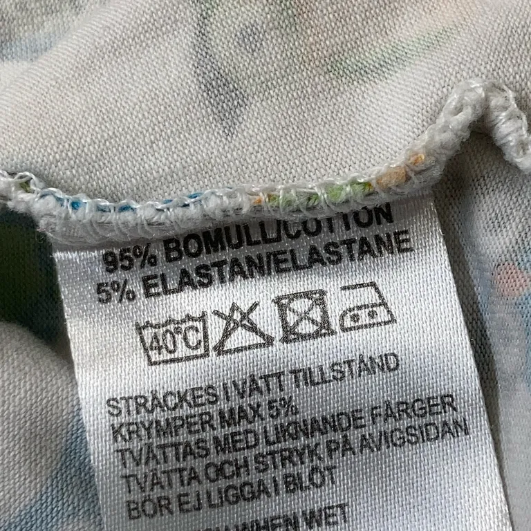 Klänning (Vit, Flerfärgad) från Villervalla Elastan - Materialetikett