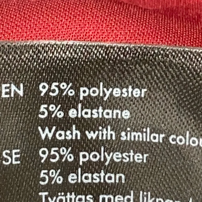 Mantel (Svart, Röd) från Lindex Kids Polyester, Elastan - Materialetikett