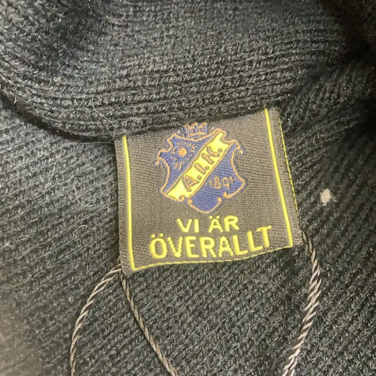 Toppluva (Svart) från A.I.K 1891 - Varumärke