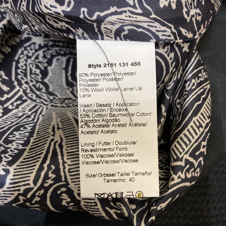 Klänning (Moderiktig just nu! Tuff festklänning!) från DAY Birger et Mikkelsen Polyester, Ull, Bomull, Acetat, Viskos - Materialetikett