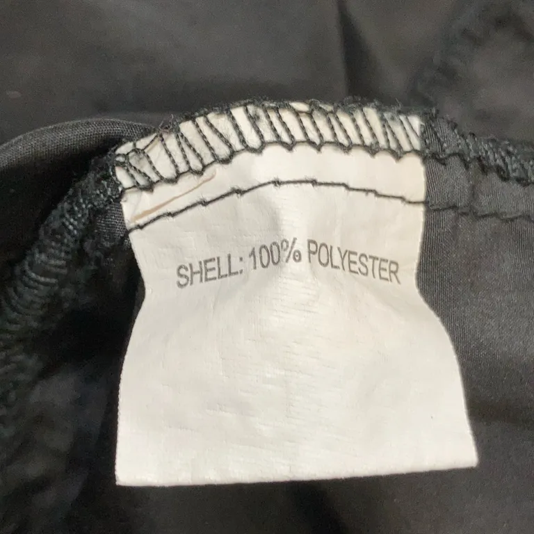 Jacka (Svart) från Equipe Polyester - Materialetikett