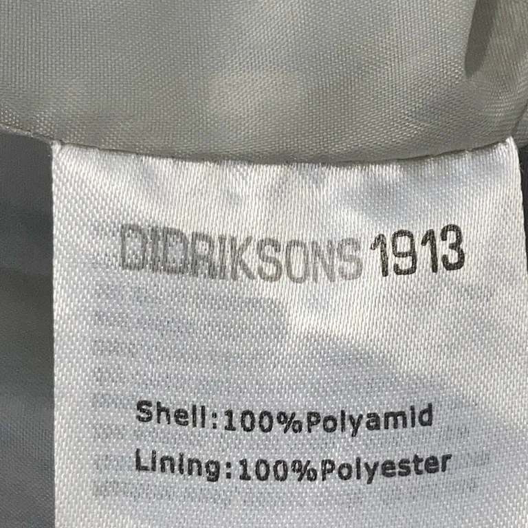 Skaljacka (Svart) från Didriksons 1913 Polyamid, Polyester - Materialetikett