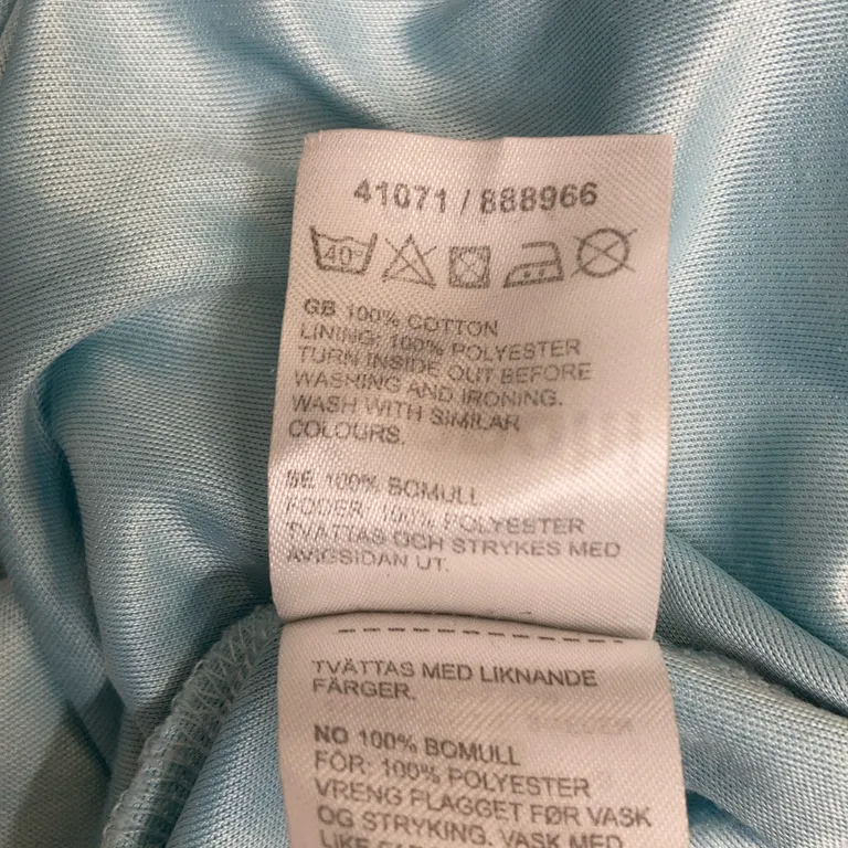 Klänning (Turkos) från Disney Frozen Polyester, Bomull - Materialetikett