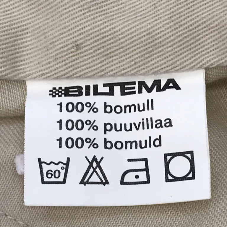 Väst (Beige) från Biltema Bomull - Materialetikett