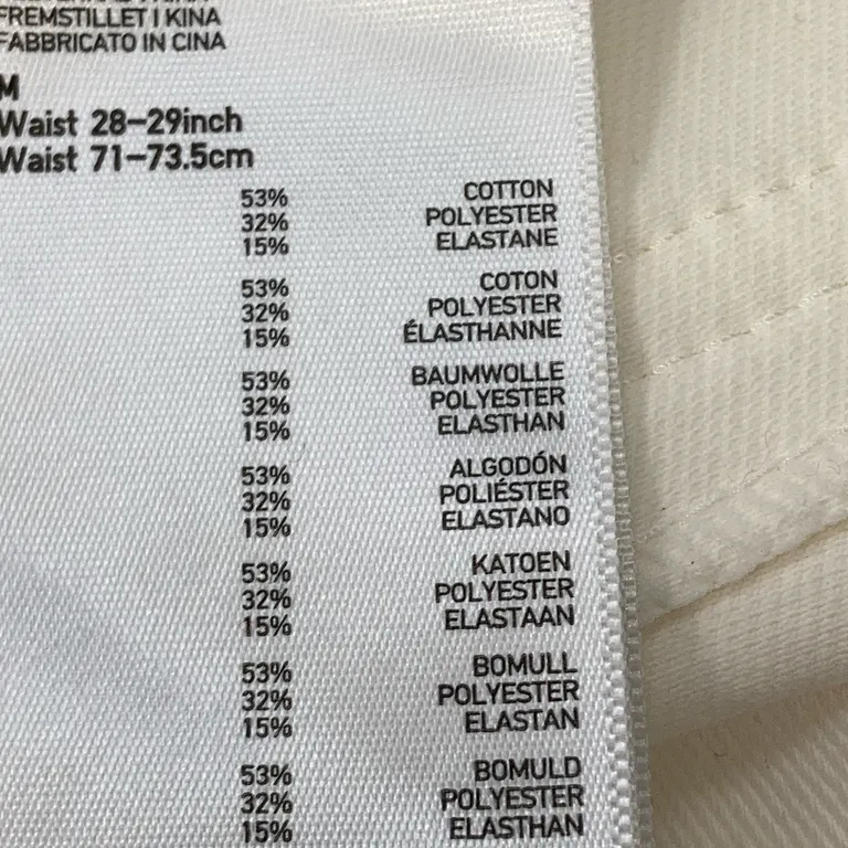 Pantalon (Blanc) de Uniqlo Coton, Élasthane, Polyester - Étiquette du matériau