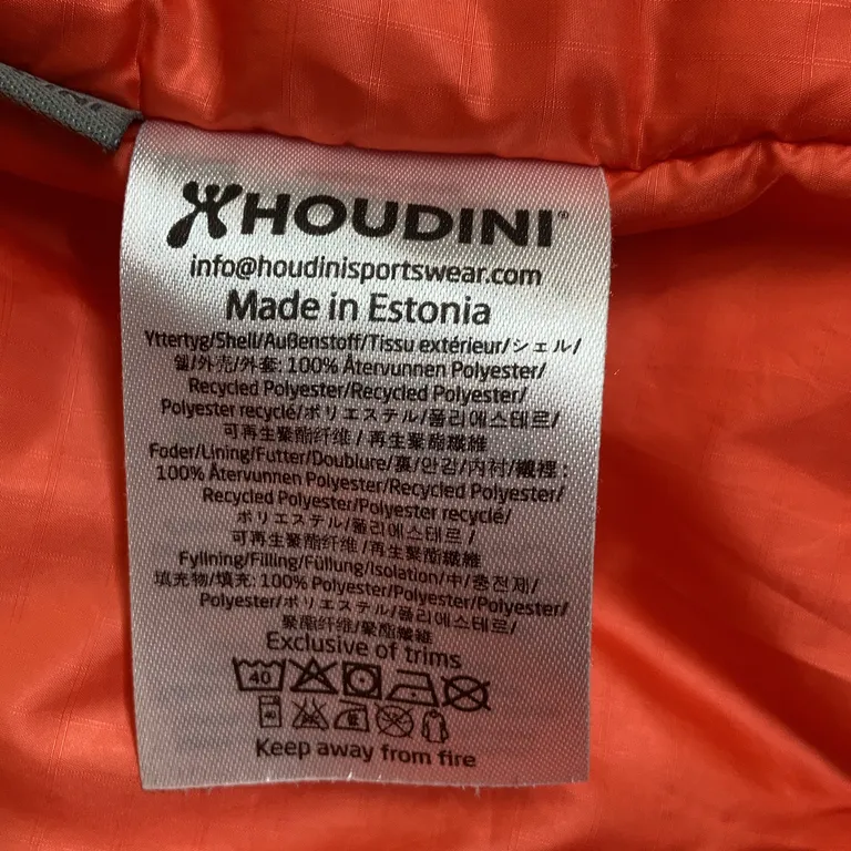 Lättviktsjacka (Orange) från Houdini Polyester - Materialetikett