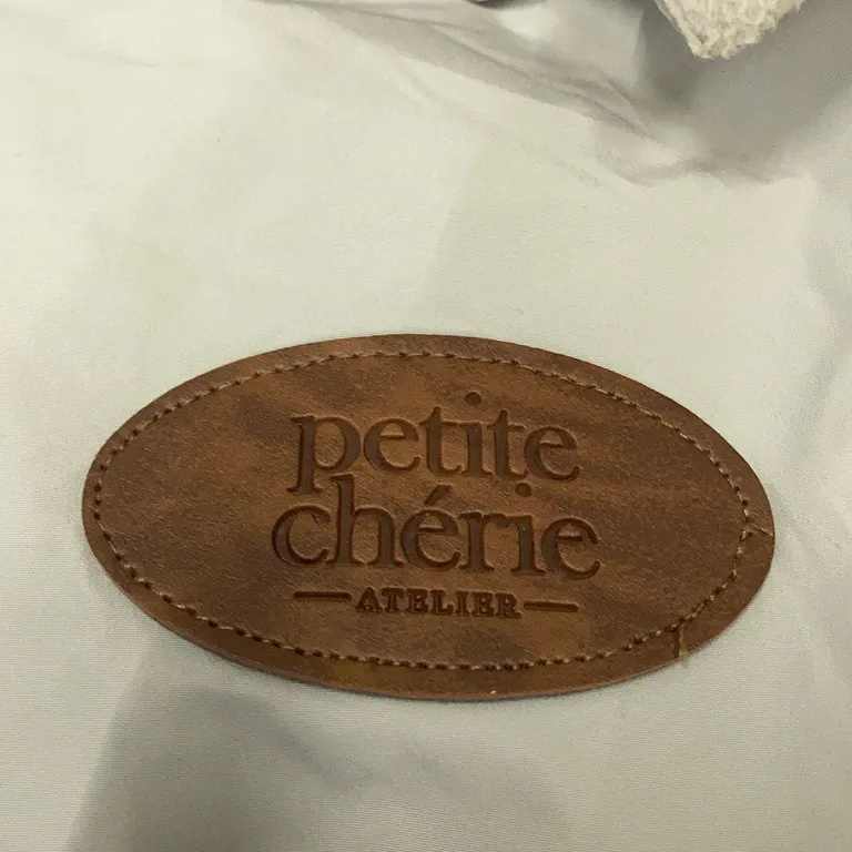 Åkpåse (Beige) från Petite Chérie - Varumärke