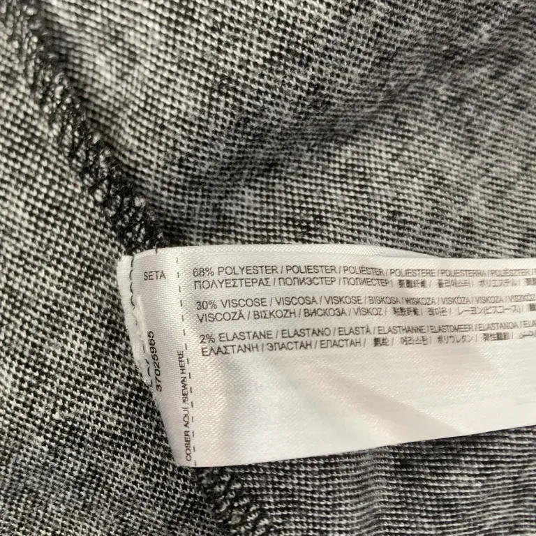 Klänning (Svart, Vit) från Mango Elastan, Polyester, Viskos - Materialetikett