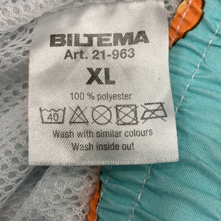 Träningsshorts (Turkos, Flerfärgad) från Biltema Polyester - Materialetikett