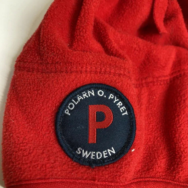 Mössa (Vindfleece med förstärkt vindstopp över öronen ) från Polarn O. Pyret Polyester - Varumärke