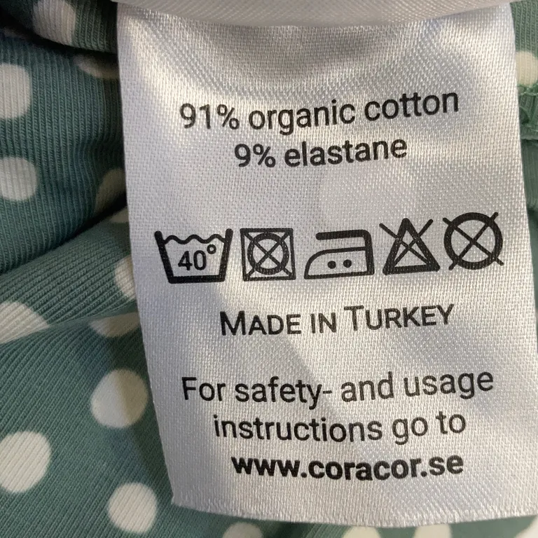 Babyfilt (Grön, Vit) från Coracor Ekologisk bomull, Elastan - Materialetikett