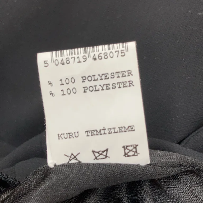 Klänning (Svart) från PSG Polyester - Materialetikett