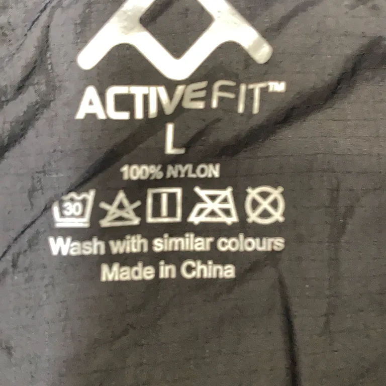 Träningsjacka (Svart) från Active Fit Nylon - Materialetikett