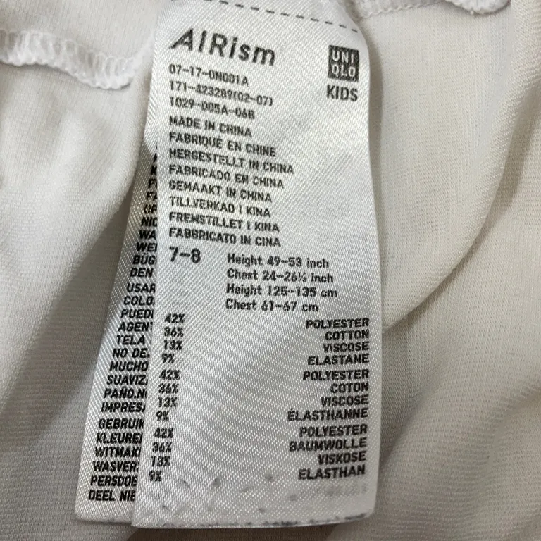 Topp (Vit) från Uniqlo Bomull, Elastan, Polyester, Viskos - Materialetikett