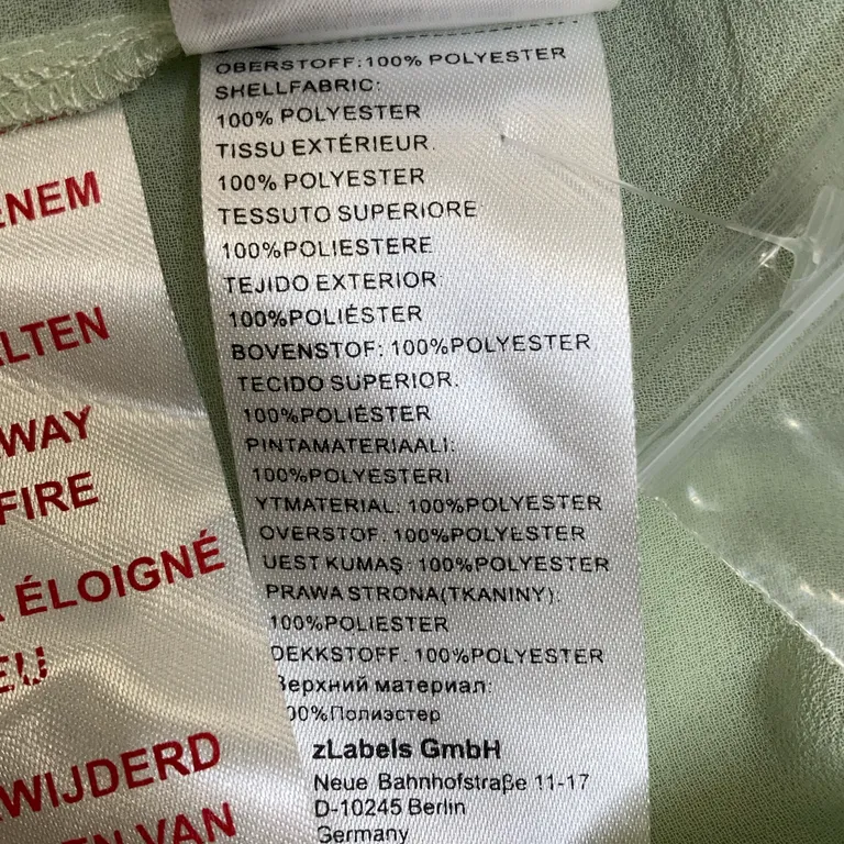 Linne (Grön, Vit) från Mint & Berry Polyester - Materialetikett