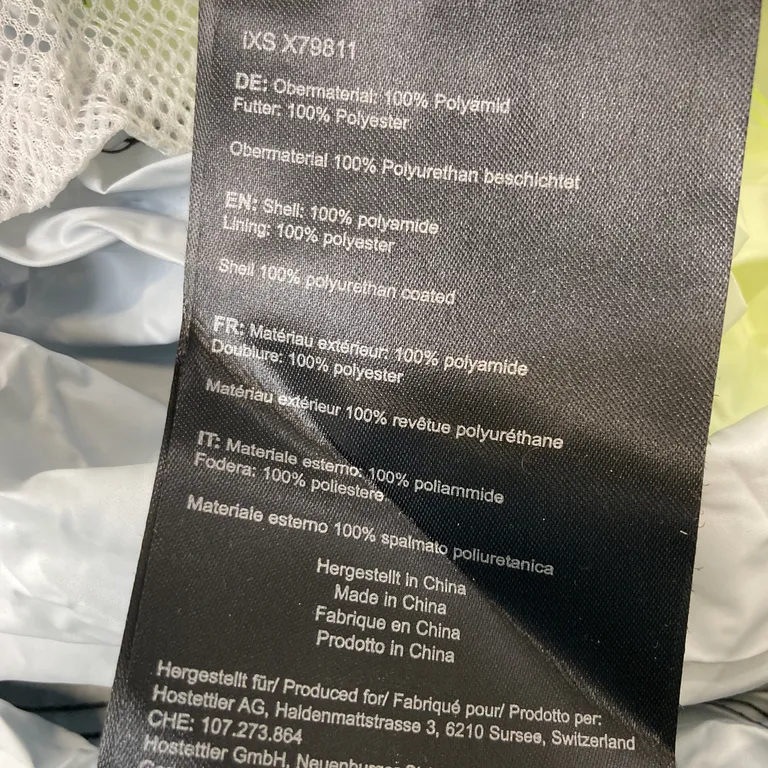 Torrdräkt (Svart, Gul) från Idcs Polyamid, Polyester, Polyuretan - Materialetikett