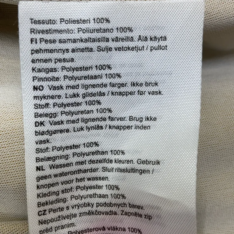 Regnjacka (Gul) från Tretorn Polyester, Polyuretan - Materialetikett