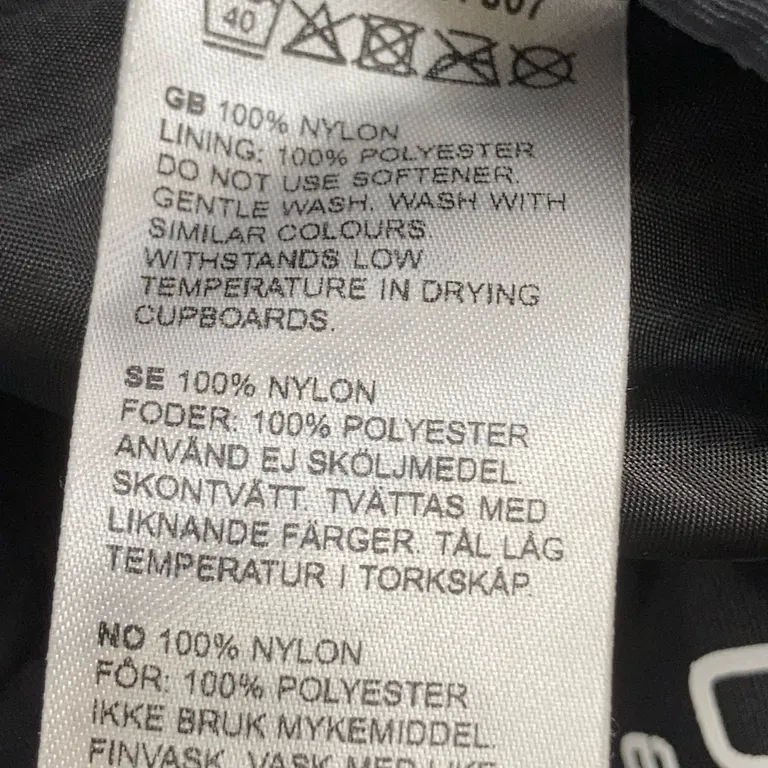 Överdragsbyxor (Svart) från Kaxs Proxtec Nylon, Polyester - Materialetikett