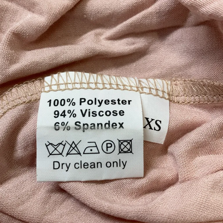 Klänning (Rosa) från Ida Sjöstedt Polyester, Viskos, Elastan - Materialetikett